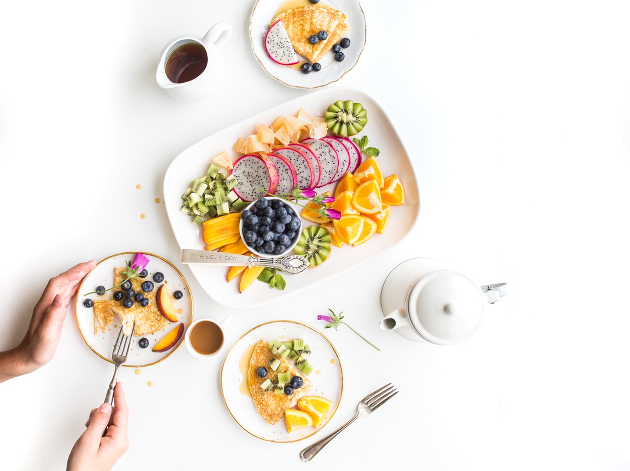 Sliced oranges, kiwi, melon, blueberry and dragonfruit