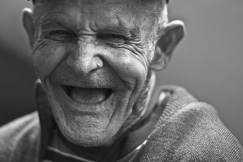 photo of an old man smiling- world of social media