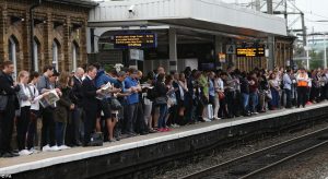 London Cummutters all looking at devices or other medias.