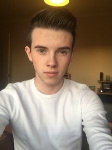 Selfie of Connor Bean taken in Bedroom and wearing white T-shirt. The creator of the blog Logged into terrorism 