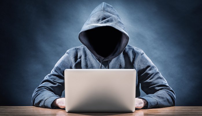 Faceless man on laptop