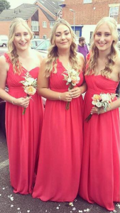 A picture of me and my sisters at my mums wedding (Me on the right, Lauren in the middle and Susie my twin on the left)