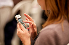 Woman using social media on her mobile phone