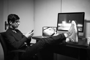 Person distracted with feet on desk