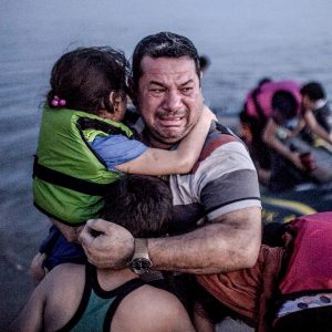 Father arrives safely with children arriving on shore