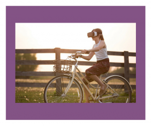 Girl on a bike wearing a VR box